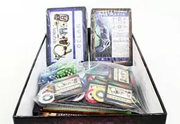Shrink wrap the cards inside your tuck box, two piece box or magnetic close box.